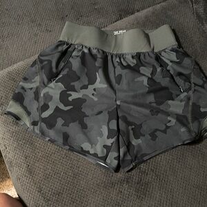Green military print jogging shorts.